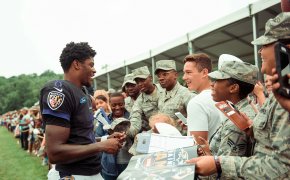 Lamar Jackson interacts with troops