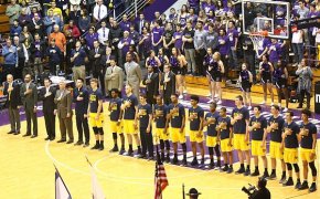Michigan basketball team lined up for the national anthem