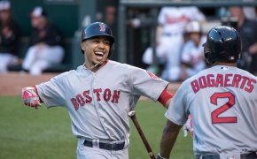 Mookie Betts celebrates at home plate.