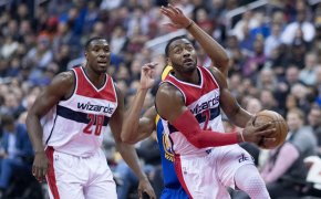John Wall drives to the hoop against the Golden State Warriors.