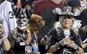 Oakland Raiders fans in their traditional attire.