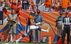 Phillip Lindsay of the Denver Broncos high-steps into the endzone