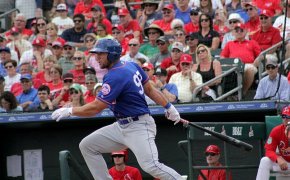 Tim Tebow connects with a pitch