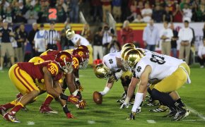 The Notre Dame Fighting Irish and the USC Trojans on the line of scrimmage