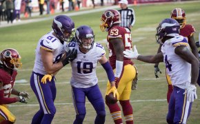 Adam Thielen celebrates a touchdown with Vikings teammates