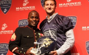 Austin Kendall receiving his Semper Fidelis All-American Bowl jersey in 2015.
