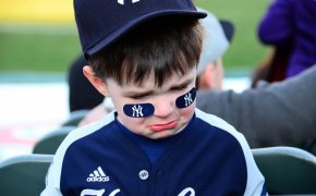 A young Yankee fan shedding tears.