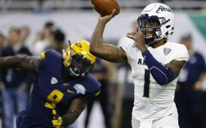 Kato Nelson throwing a pass for Akron.