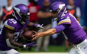 Dalvin Cook takes a handoff from Kirk Cousins