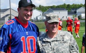 Doug Marrone having his picture taken with the troops