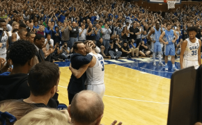 Duke coach Mike Krzyzewski hugging guard Grayson Allen
