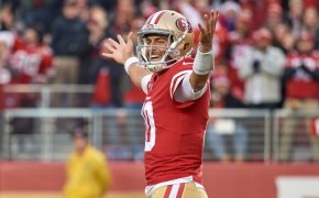 Jimmy Garoppolo of the 49ers with his hands in the air
