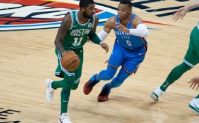 Kyrie Irving is guarded closely by Russell Westbrook
