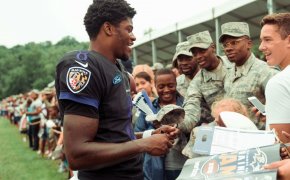 Lamar Jackson signing autographs for the troops