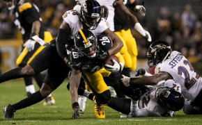Steeler RB Le'Veon Bell being tackled.
