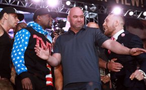 Floyd Mayweather and Conor McGregor separated by Dana White at a press conference