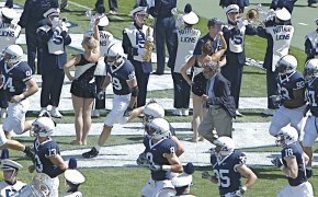 Penn State players running onto the field.