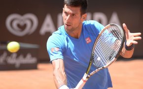 Novak Djokovic hitting a volley