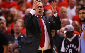 Nick Nurse with his hands in the air