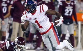 Ole Miss wideout DK Metcalf eludes a Mississippi State defender.