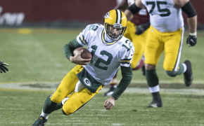 Packers QB Aaron Rodgers sliding to the ground.