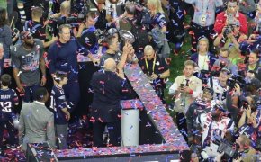 Tom Brady raising the Lombardi Trophy after Super Bowl 51