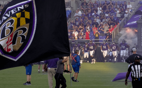 A Baltimore Ravens flag flying on the field pregame.