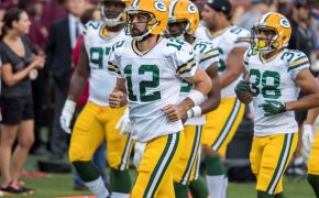 Aaron Rodgers leads the Packers to the locker room.
