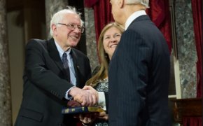 Bernie Sanders and Joe Biden shaking hands.