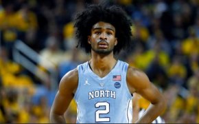 UNC point guard Coby White stands arms akimbo