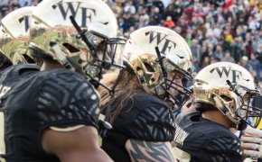 Players from Wake Forest and Temple shake hands before the Coin Toss during the 2016 Military Bowl