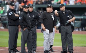 White Sox manager Rick Renteria talks with the umpires