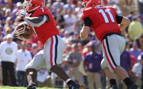 Jake Fromm handing off the ball.