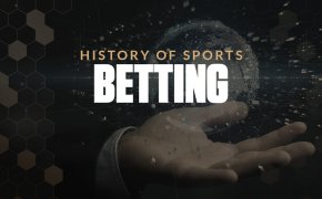 History of sports betting text overlay on hand with floating globe