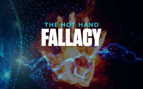 hot hand fallacy text overlay on a hand made out of flames