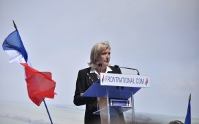 Le Pen speaks at the podium