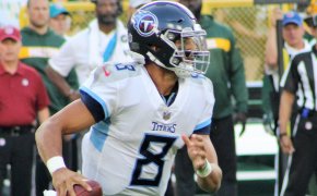 Marcus Mariota runs from pressure against the Green Bay Packers