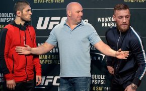 Dana White stands between Conor and Khabib at the staredown.