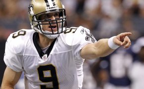 New Orleans Saints quarterback Drew Brees calling a play at the line of scrimmage during a game.