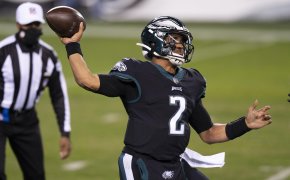 Philadelphia Eagles quarterback Jalen Hurts throwing a pass in a game.