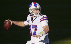 Buffalo Bills quarterback Josh Allen throwing a football during a NFL football game.