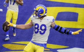 Los Angeles Ram tight end Tyler Higbee celebrating after catching a touchdown during the second half of a game.