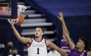 Gonzaga guard Jalen Suggs going up for a layup against Northwestern State guard Jairus Roberson