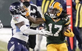 Green Bay Packers' Davante Adams trying to get past Tennessee Titans' Malcolm Butler during a game.