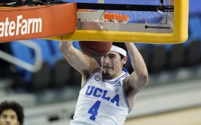UCLA guard Jaime Jaquez Jr. dunking the ball during a college basketball game.