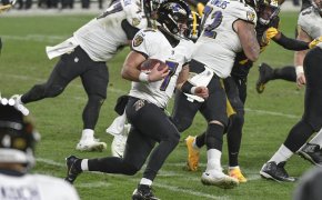 Baltimore Ravens quarterback Trace McSorley about to slide