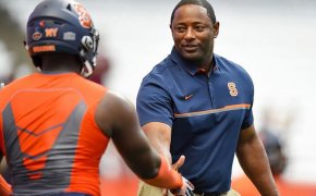 Dino Babers shaking hands with a player