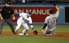 Max Muncy laying a tag on Austin Meadows at second base