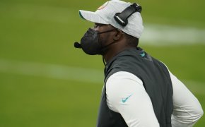 Brian Flores on the Miami sideline in a mask
