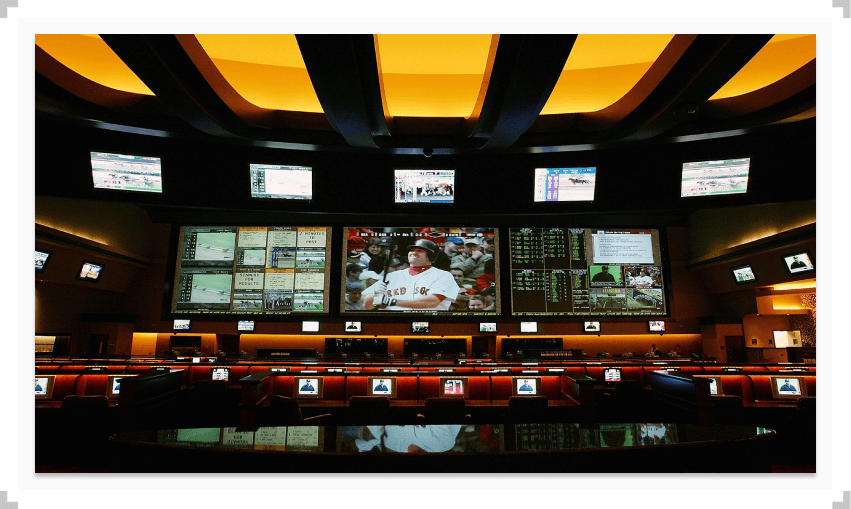 Multiple televisions displaying sports games in a retail sportsbook location